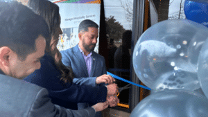 Philadelphia hospitality staffing team cutting ribbon at office opening